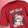 Just Relax Teddy Tee, close-up of 'JUST RELAX' text and teddy bear design.