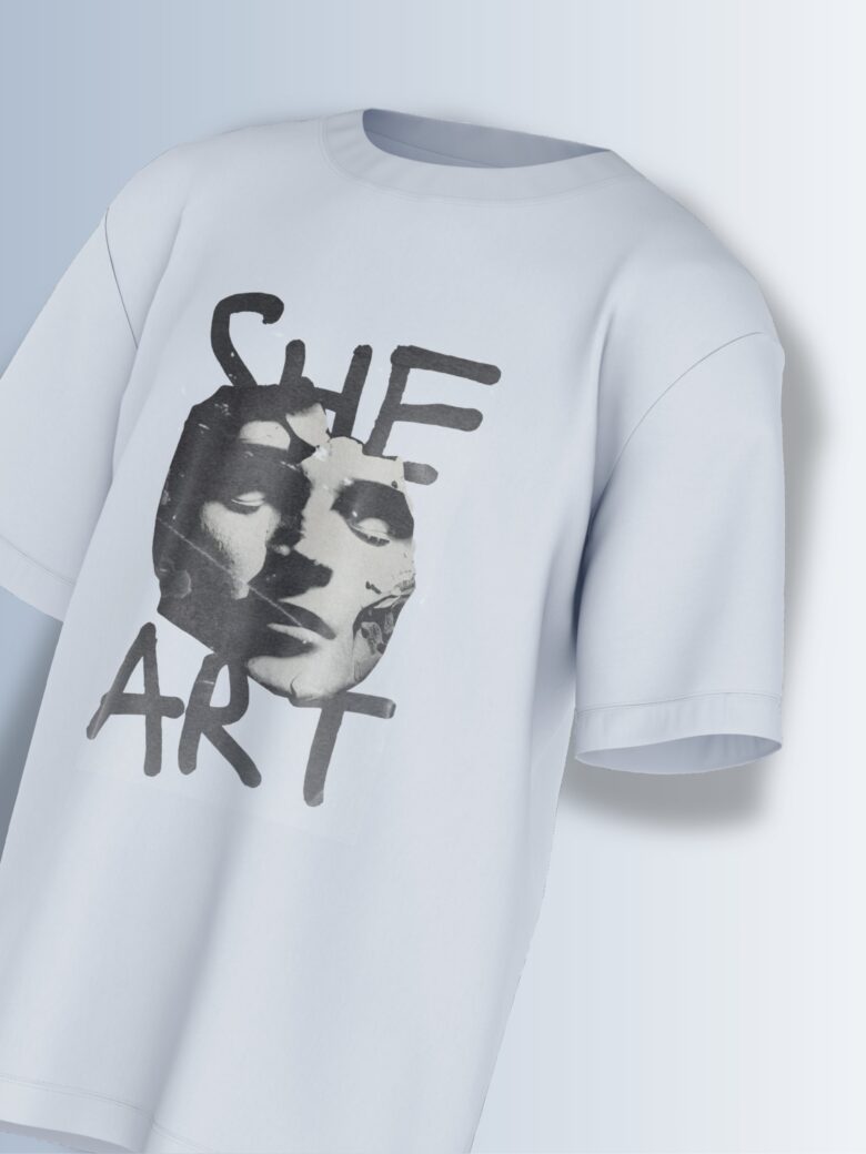 She Art Tee, close-up of 'SHE ART' hand-lettered text.