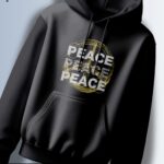 Black hoodie with the word "PEACE" repeated three times around a peace symbol with a distressed, vintage effect.