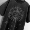 Distressed black oversized T-shirt with a sun and moon graphic and celestial elements.