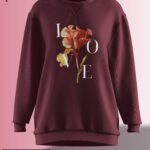 Deep burgundy oversized sweatshirt featuring a floral design with the word 'LOVE' elegantly placed around the flower.