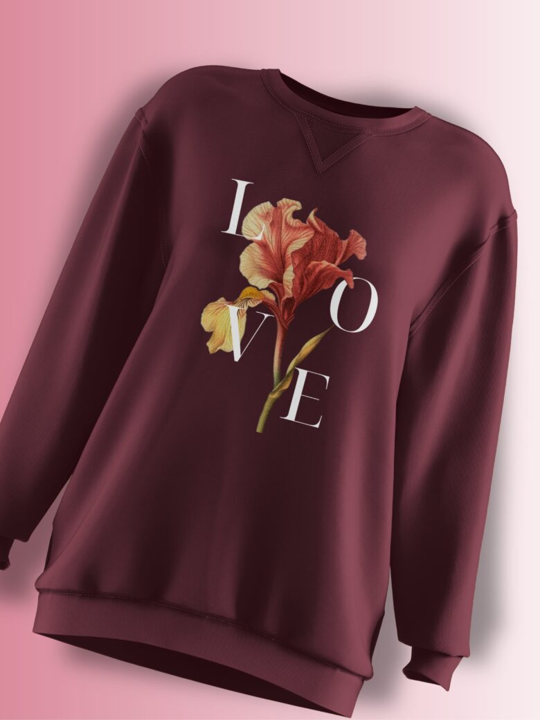 Deep burgundy oversized sweatshirt featuring a floral design with the word 'LOVE' elegantly placed around the flower.