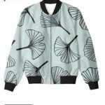 A light blue women's bomber jacket with bold black ginkgo leaf patterns, creating a stylish and modern design.