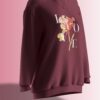 Deep burgundy oversized sweatshirt featuring a floral design with the word 'LOVE' elegantly placed around the flower.