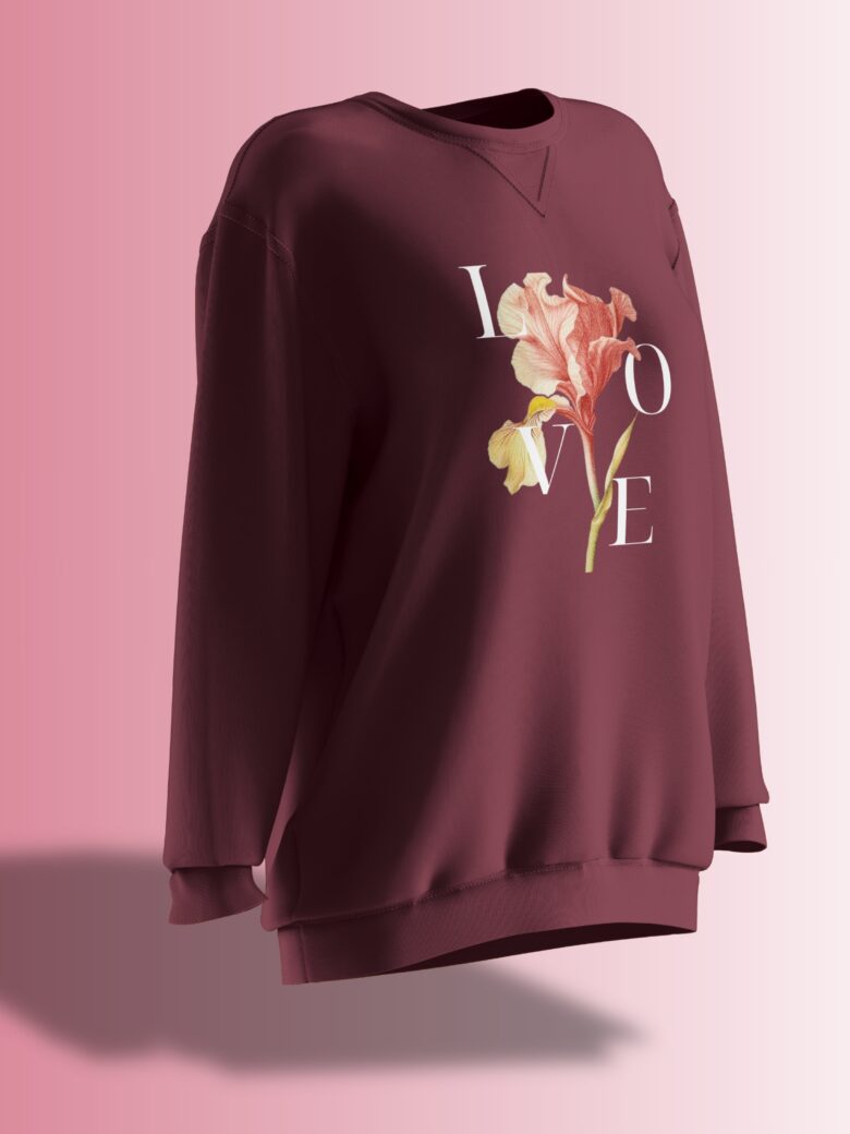 Deep burgundy oversized sweatshirt featuring a floral design with the word 'LOVE' elegantly placed around the flower.