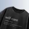 Distressed black oversized T-shirt with 'self-care' text, phonetic pronunciation, and definition.