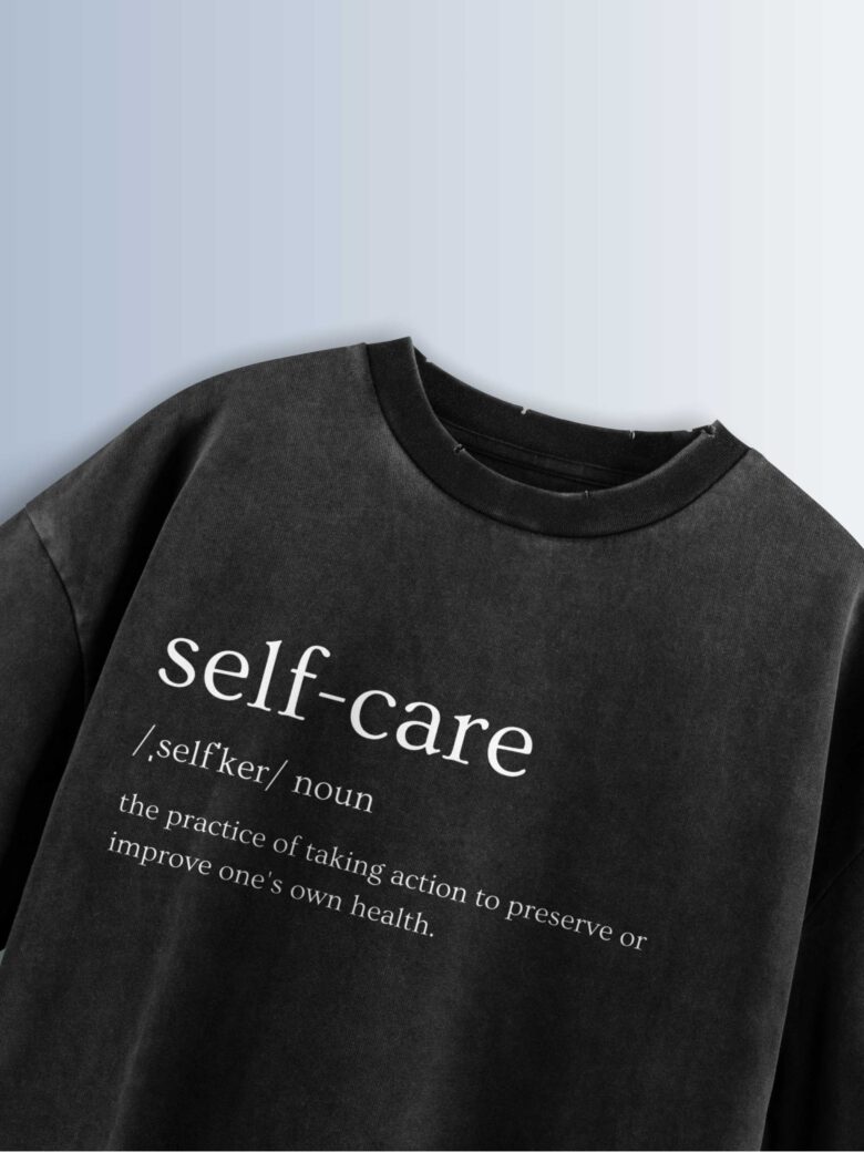 Distressed black oversized T-shirt with 'self-care' text, phonetic pronunciation, and definition.