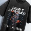 Distressed black oversized T-shirt with 'LONELY ASTRONAUT' text and an astronaut graphic floating in space.