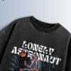 Distressed black oversized T-shirt with 'LONELY ASTRONAUT' text and an astronaut graphic floating in space.