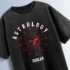 Distressed black oversized T-shirt with 'ASTROLOGY' and 'ZODIAK' text and a sun face graphic surrounded by zodiac symbols.