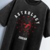 Distressed black oversized T-shirt with 'ASTROLOGY' and 'ZODIAK' text and a sun face graphic surrounded by zodiac symbols.