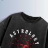 Distressed black oversized T-shirt with 'ASTROLOGY' and 'ZODIAK' text and a sun face graphic surrounded by zodiac symbols.