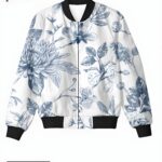 A white women's bomber jacket with intricate blue botanical patterns, creating an elegant and serene design.