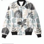 A pastel women's bomber jacket with whimsical butterfly, rainbow, and botanical patterns, creating a playful and joyful design.