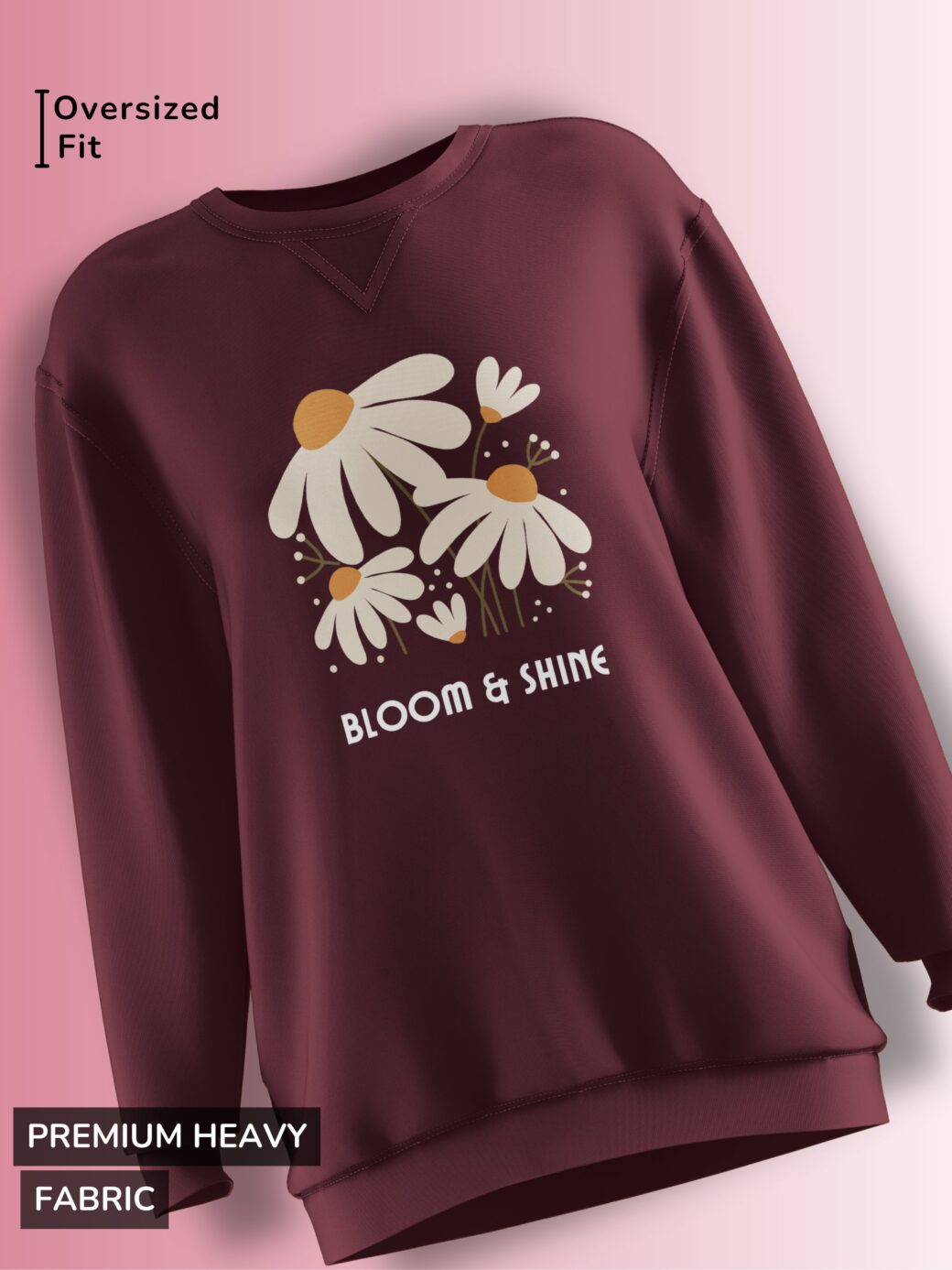 Maroon fleece sweatshirt with a daisy floral design and the phrase 'BLOOM & SHINE' in soft pastel colors.