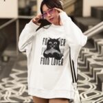 White fleece sweatshirt featuring a black cat holding a fish with the words 'FOOD LOVER' in bold typography.