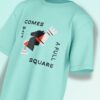 Mint green oversized T-shirt featuring an abstract black chess knight with typography reading 'LIFE COMES A FULL SQUARE'.