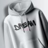 Light grey hoodie with the word "DREAM" in a bold, slightly stylized, black font.