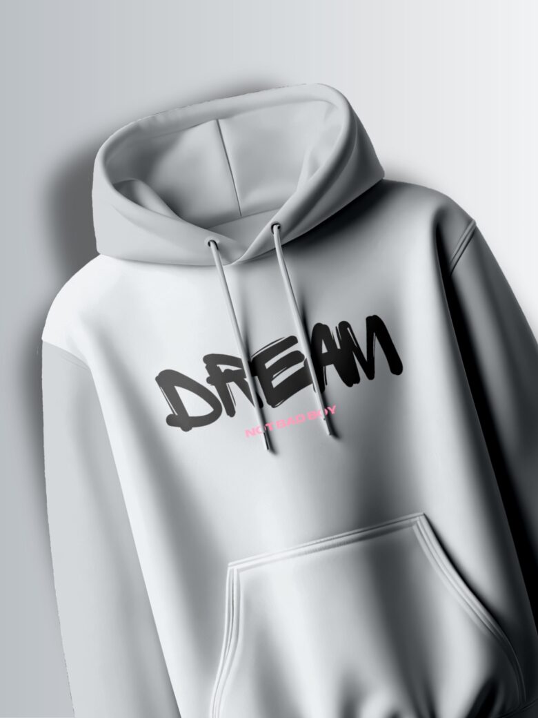 Light grey hoodie with the word "DREAM" in a bold, slightly stylized, black font.