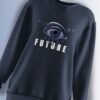 Dark oversized sweatshirt featuring a futuristic cyber eye design with 'FUTURE' typography.
