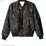 A charcoal women's bomber jacket with delicate, golden-toned floral illustrations, creating a sophisticated and romantic design.