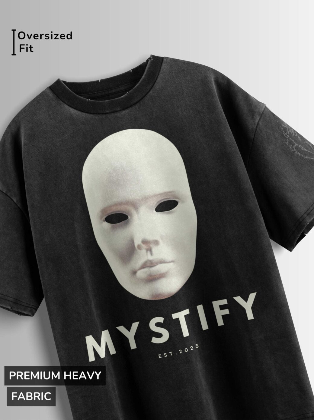 Distressed black oversized T-shirt with a blank mask graphic, 'MYSTIFY' text, and 'EST 2025' text.