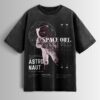 Distressed black oversized T-shirt with an astronaut graphic, 'SPACE OUT' text, and vintage-style space exploration details.