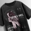 Distressed black oversized T-shirt with an astronaut graphic, 'SPACE OUT' text, and vintage-style space exploration details.