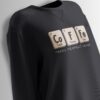 Black sweatshirt featuring a chemistry-inspired design spelling 'Co-Fe' with periodic table elements and the phrase 'Makes Perfect Sense' below.