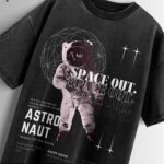 Distressed black oversized T-shirt with an astronaut graphic, 'SPACE OUT' text, and vintage-style space exploration details.