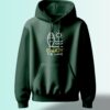 Dark green hoodie with a graphic of a stylized surfboard, sun, and waves, and the text "ENJOY THE WAVE."