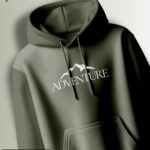 Dark olive hoodie with a white graphic of a stylized mountain range and the text "ADVENTURE."