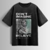 Distressed black oversized T-shirt with 'DON'T JUST IMAGINE BELIEVE' text and a stylized statue graphic.