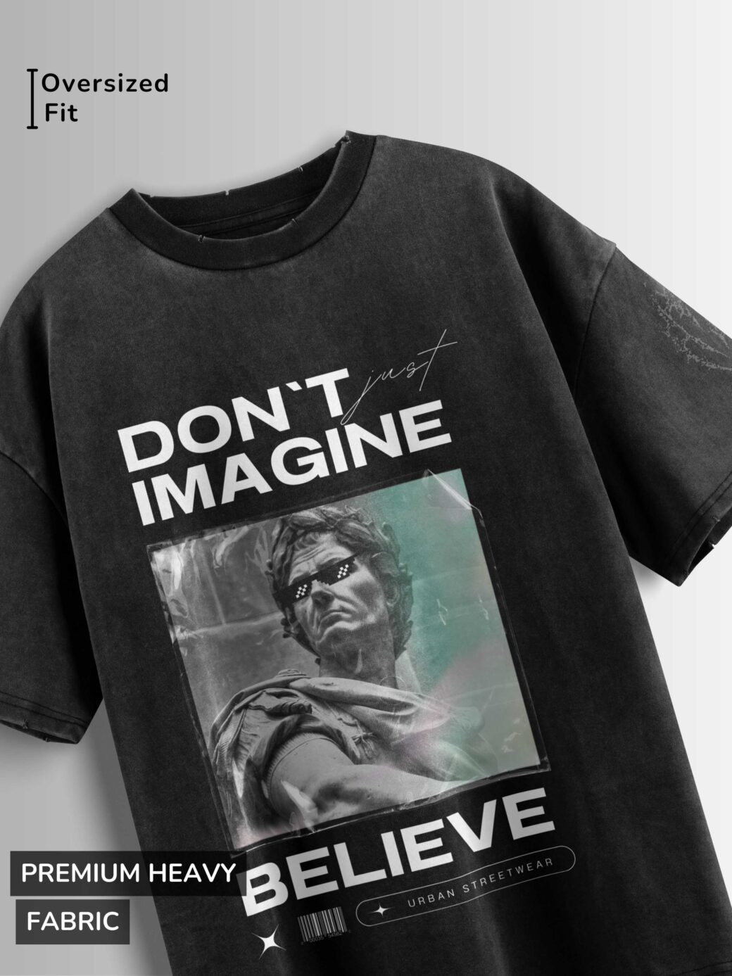 Distressed black oversized T-shirt with 'DON'T JUST IMAGINE BELIEVE' text and a stylized statue graphic.