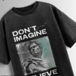 Distressed black oversized T-shirt with 'DON'T JUST IMAGINE BELIEVE' text and a stylized statue graphic.